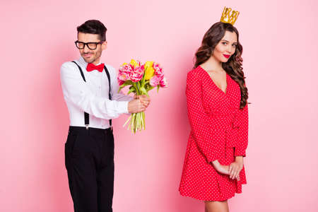 Photo of young shy guy nervous worried present flower bouquet girl princess wear golden crown...