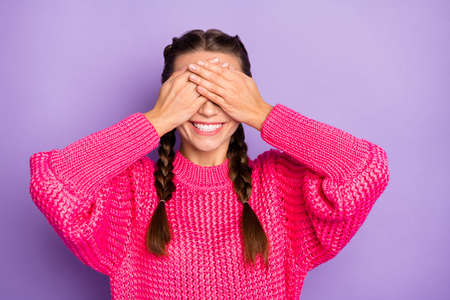 Photo of happy charming woman hold hands face cover eyes expect present isolated on purple color...