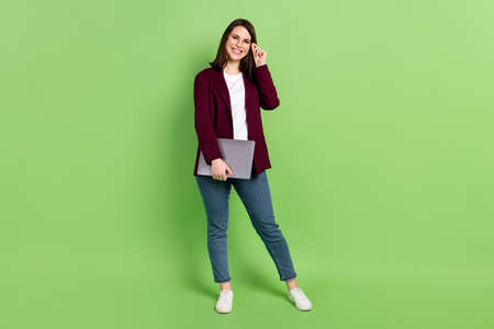 Full size photo of optimistic brown hairdo lady stand with laptop wear spectacles red cardigan jeans...