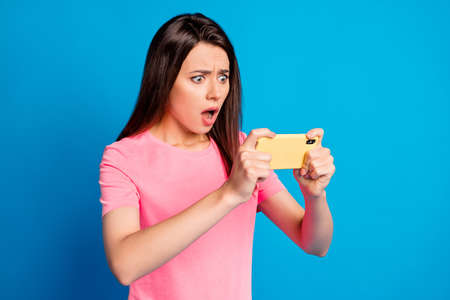 Photo portrait of brunette girl nervous losing playing video game staring opened mouth isolated on...