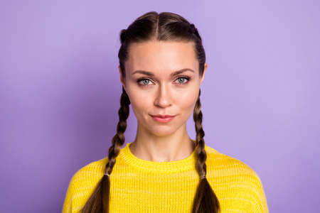Portrait of optimistic brunette girl wear yellow sweater isolated on pastel lilac color backgroundの写真素材