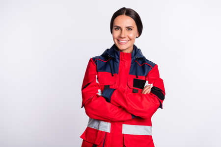 Portrait of attractive cheerful girl experienced doc paramedic folded arms medicare isolated over...
