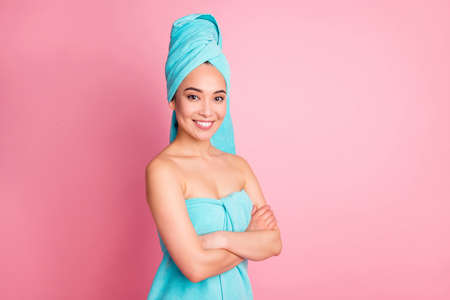 Photo of young cheerful asian girl happy positive smile folded hands enjoy cosmetology treatment isolated over pink color backgroundの写真素材