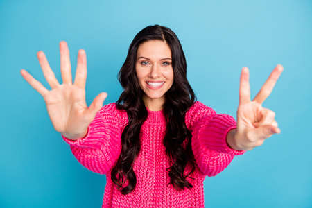 Photo of adorable person toothy smile show arms fingers numbers counting isolated on blue color...