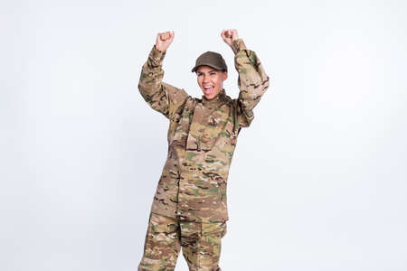 Photo of astonished lady fists up open mouth look interested empty space scream isolated on white color backgroundの写真素材