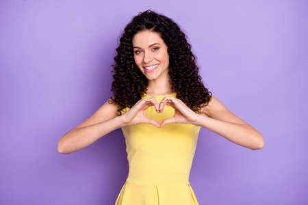 Portrait of adorable person fingers show heart symbol toothy smile look camera isolated on purple color backgroundの写真素材