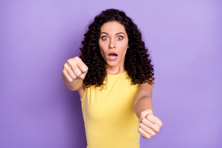 Portrait of impressed lady open mouth staring camera arms steer imagine wheel isolated on purple color backgroundの写真素材