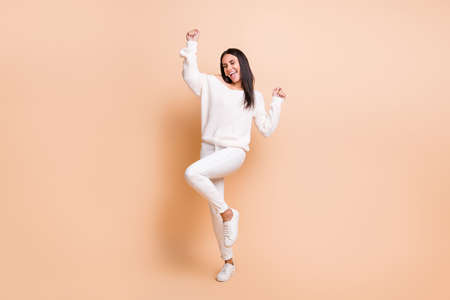 Full body photo of young attractive girl happy positive smile celebrate victory fists hands isolated...