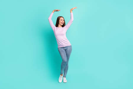 Full length body size view of attractive cheerful girl dancing having fun chill out isolated over turquoise bright color backgroundの写真素材