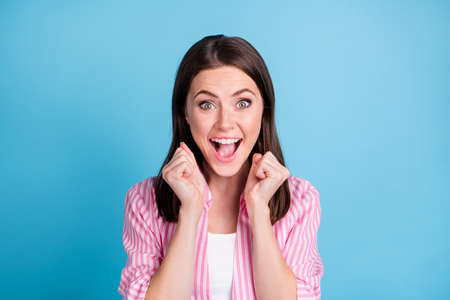 Photo portrait of screaming woman isolated on pastel blue colored backgroundの写真素材