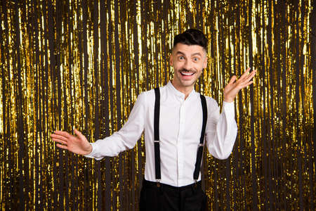 Photo of funny excited young guy dressed glamour outfit dancing rising arms hands isolated shiny...