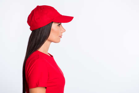 Profile side photo of young serious beautiful service delivery woman look copyspace isolated on grey color backgroundの写真素材