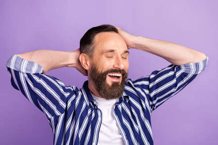 Photo of positive mature man touch hands head silky shampoo hair wash concept isolated over violet...