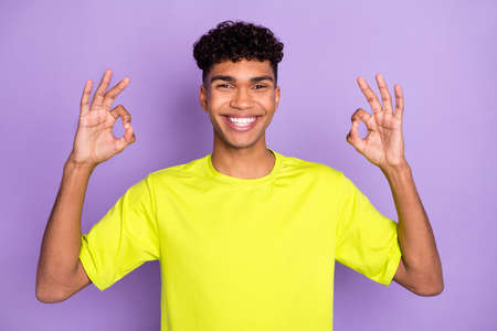 Photo of young cheerful black guy happy smile show okey sign feedback ad promo decision isolated...