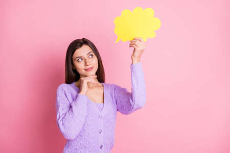 Photo of optimistic girl hold chatterbox look wear lilac sweater isolated on pink color background