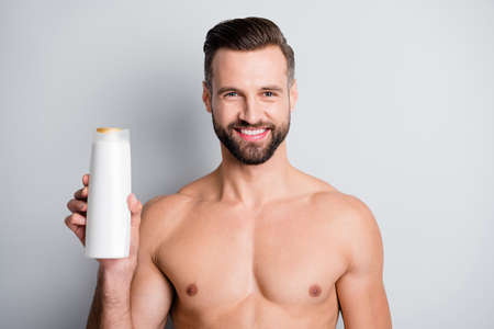 Photo of young handsome stubble man happy smile enjoy hygiene haircare shampoo isolated over grey color backgroundの写真素材