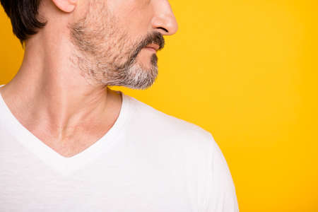Cropped profile side photo of man chin beard groomed serious face isolated on shine yellow color...