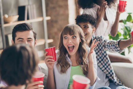 Portrait of attractive overjoyed funky cheerful best friends spending time having fun drinking lager...