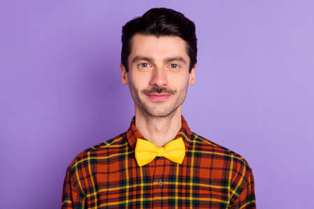 Close-up portrait of attractive content funky guy wearing checked shirt isolated over violet purple...