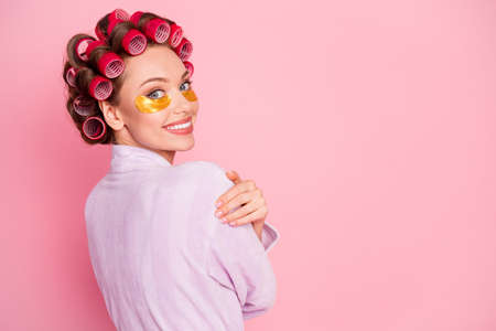 Photo of pretty nice lady hugs shoulder have under eye pads isolated on pastel pink color backgroundの写真素材