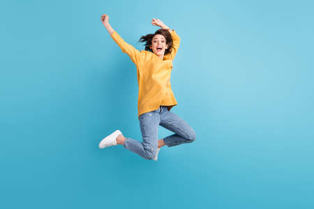 Full length body photo of cheerful happy girl with short hairstyle jumping high hands over head...