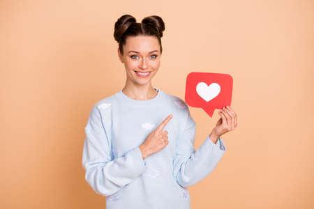 Photo of optimistic nice brunette lady point like wear sweater isolated on pastel beige color...