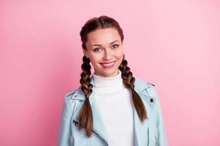 Photo of young attractive girl happy positive smile wear leather jacket isolated over pink color backgroundの写真素材