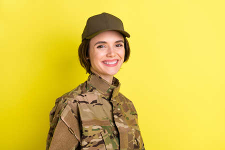 Profile photo of pretty satisfied person toothy smile look camera isolated on yellow color backgroundの写真素材