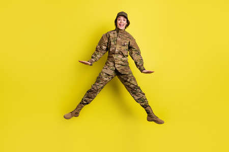 Full size photo of carefree cheerful girl open mouth scream have good mood isolated on yellow color...