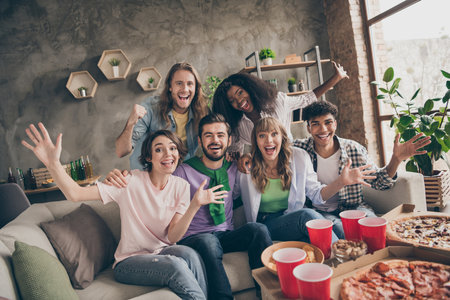 Photo portrait of students joking laughing together in room dormitoryの写真素材