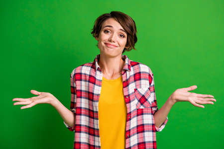 Photo of funny cute person show arms dont know plaid outfit yellow t-shirt isolated on green color...