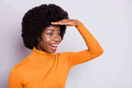 Photo of astonished wavy hairdo dark skin person arm on forehead look empty space isolated on grey color backgroundの写真素材