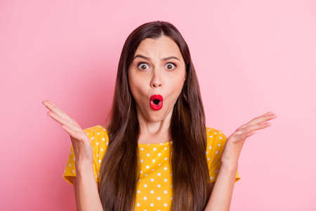 Photo of young attractive girl amazed shocked surprised fake novelty news isolated over pastel color backgroundの写真素材