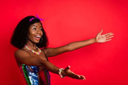 Photo of cute charming curly dark skin woman dressed pinup clothes open arms empty space smiling...