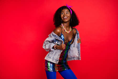 Photo of funny excited curly dark skin woman dressed pinup clothes smiling dancing looking copyspace...