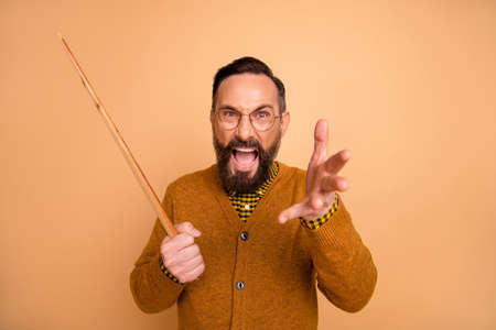 Photo of furious mature man teacher scream school problem hold pointer isolated over beige color...