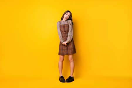 Full size photo of stressed brunette lady stand wear brown shirt dress boots isolated on vivid...
