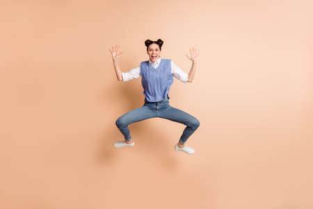 Full size photo of brunette impressed lady jump wear white shirt blue vest jeans sneakers isolated...
