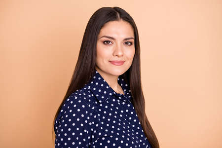 Portrait of beautiful content business lady skilled insurance expert isolated over beige pastel color backgroundの写真素材