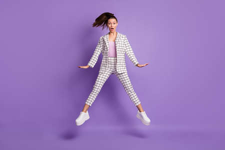 Full size photo of young attractive girl amazed shocked surprised news fake novelty jump up isolated...
