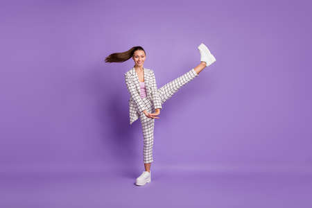 Full body photo of young attractive girl happy positive smile have fun enjoy isolated over purple color backgroundの写真素材