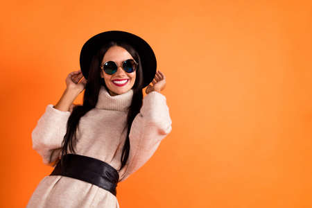 Photo of young charming lovely smiling good mood girl wear sunglases and black hat isolated on...