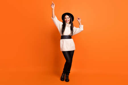 Full size photo of young beautiful smiling good mood woman dancing point fingers up isolated on...