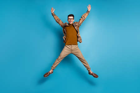 Full size photo of young happy crazy smiling excited positive cheerful man jumpin star pose isolated...