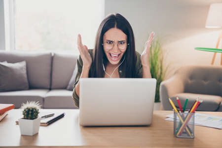 Photo of young angry furious stressed woman in glasses has video call speak tell explain problem...