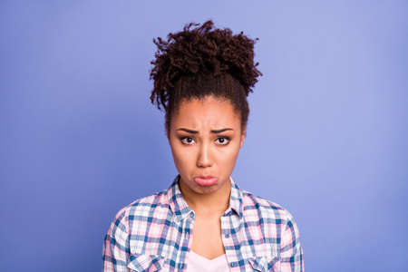 Portrait of nice sad brunette hairdo lady wear white shirt isolated on vibrant blue color backgroundの写真素材