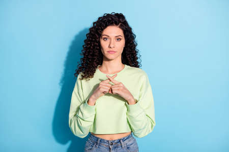 Photo of strict charming lady crossed fingers stop sign wear cropped green pullover isolated blue...