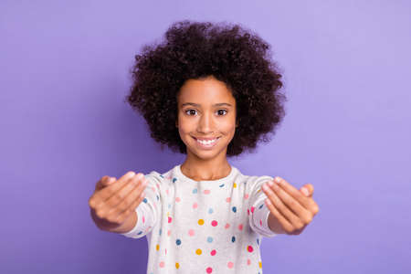 Photo of dark skin happy smile brown haired girl invite you wear casual outfit isolated on violet...