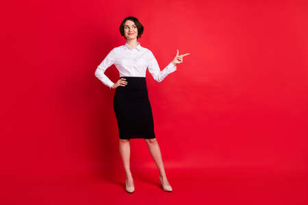 Full length body size photo curious business woman showing finger copyspace isolated vibrant red...