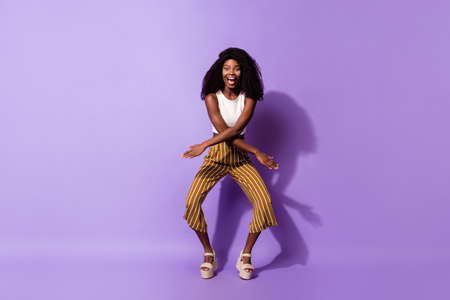 Full length body size view of pretty funny cheerful girl dancing having fun fooling isolated over...